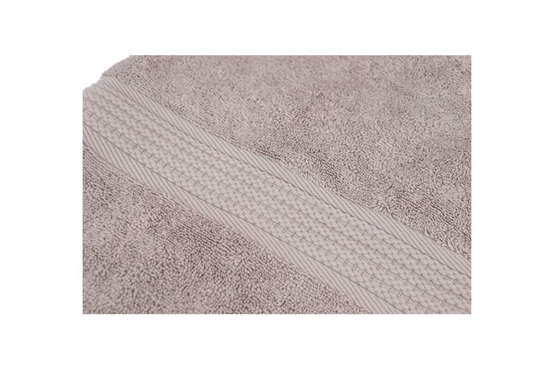 Toalla jumbo Mirage 30x60 pulgadas gris Royal Heritage, acercamiento al tejido y el detalle del borde decorativo