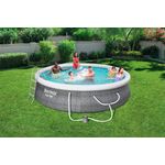 Set piscina redonda Fast Set gris de 4.57 m de diámetro por 1.07 m de alto Bestway, instalada en jardín con personas y