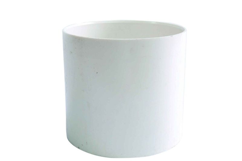 Unión PVC lisa sanitario 6 pulgadas Durman, vista frontal del accesorio cilíndrico de color blanco