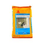 Sika MonoTop-101 blanco de 20 kg Sika, bolsa amarilla con ilustración de aplicación en muro