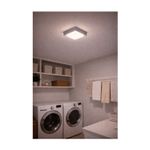 Luminaria plafón para exterior LED Okab I gris 15 W 920 lm 6500 K IP54 127 V Tecnolite, instalada y encendida en lavandería