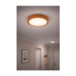 Luminaria de sobreponer redonda 18 W 6000 K madera General Lighting, instalada y encendida en el techo de una habitación