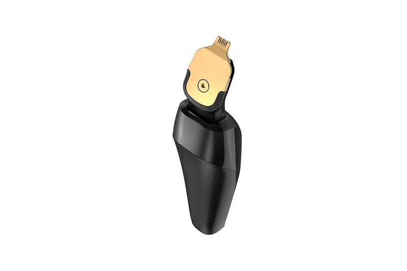 Rasuradora T-Series Remington, primer plano del cabezal dorado y cuerpo negro desde un ángulo superior