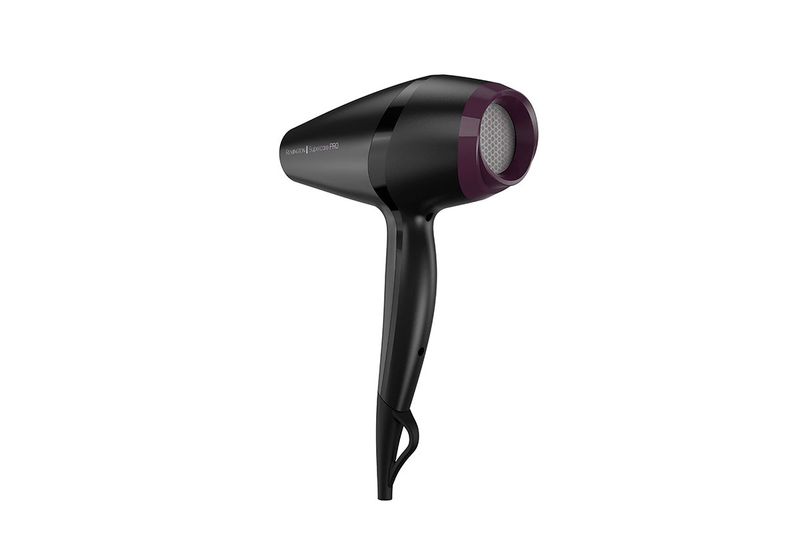 Secadora de cabello Supercare Pro con turmalina Remington, vista lateral del equipo color negro con detalles púrpura