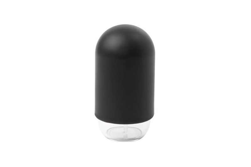 Dispensador de jabón negro moldeado plástico Umbra, vista frontal con cuerpo negro mate y base transparente