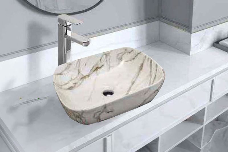 Lavamano sobreponer RJ 1034 rect blanco mármol gold it InletCera, vista diagonal sobre mueble con grifería cromada