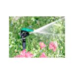 Cabeza para aspersor de impacto sprinkler 3 pulgadas 360° Rain Bird, en funcionamiento regando flores en el jardín
