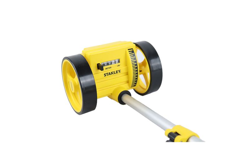 Rueda medidora análoga Stanley de 1000 mts, primer plano del contador amarillo y ruedas negras con mango metálico