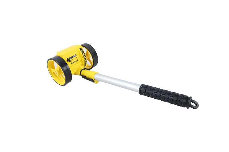 Rueda medidora 1000 mts análoga Stanley, vista lateral completa con mango negro y cuerpo amarillo