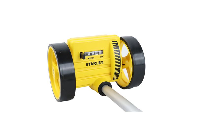 Rueda medidora 1000 mts análoga Stanley, detalle frontal del contador amarillo con escala en metros y centímetros