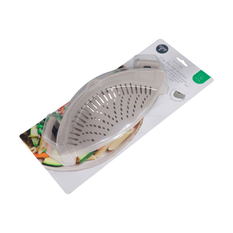 Colador de silicona con clips Core Kitchen, producto en su empaque blister con ilustración de vegetales