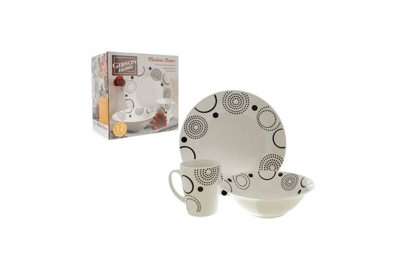 Juego de vajilla 12 piezas blanco y negro con diseño Gibson Home, plato, taza y bowl junto a su empaque