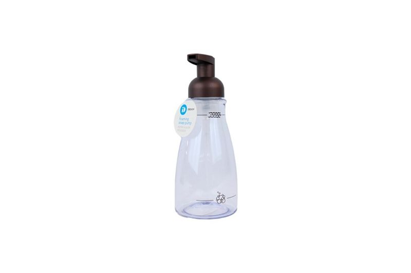 Dispensador jabón espuma acrílico Interdesign bronce, vista frontal con etiqueta blanca colgando del cuello