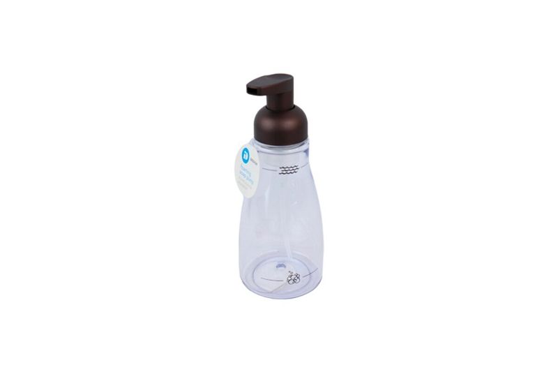 Dispensador jabón espuma acrílico Interdesign bronce, cuerpo transparente con etiqueta blanca y bomba color bronce