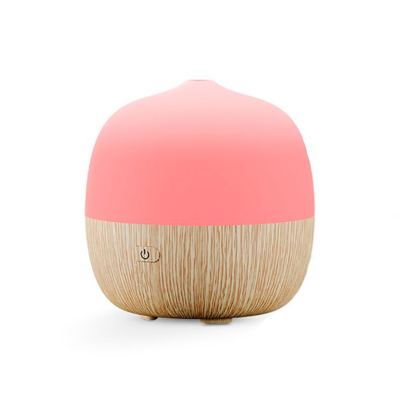 Difusor mini smart Nexxt, vista frontal del equipo con base de madera y parte superior en color rosa