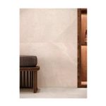 Porcelanato 59x150 Limestone Bone Mate Porcelanosa, ambiente decorado con banco de madera y mueble lateral