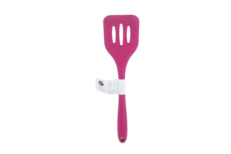 Cuchara ranura silicone colores sólidos Core Kitchen, color rosa fucsia con etiqueta blanca en el mango