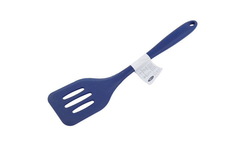 Cuchara ranura silicone colores sólidos Core Kitchen, vista lateral completa en color azul con etiqueta blanca en el mango