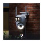 Cámara smart de exterior motorizada doble lente Nexxt, instalada en pared de ladrillos rojos con luces led encendidas