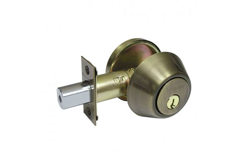 Cerrojo llave/mariposa Kent Yale bronce antiguo, vista lateral del mecanismo con cilindro y pestillo extendido