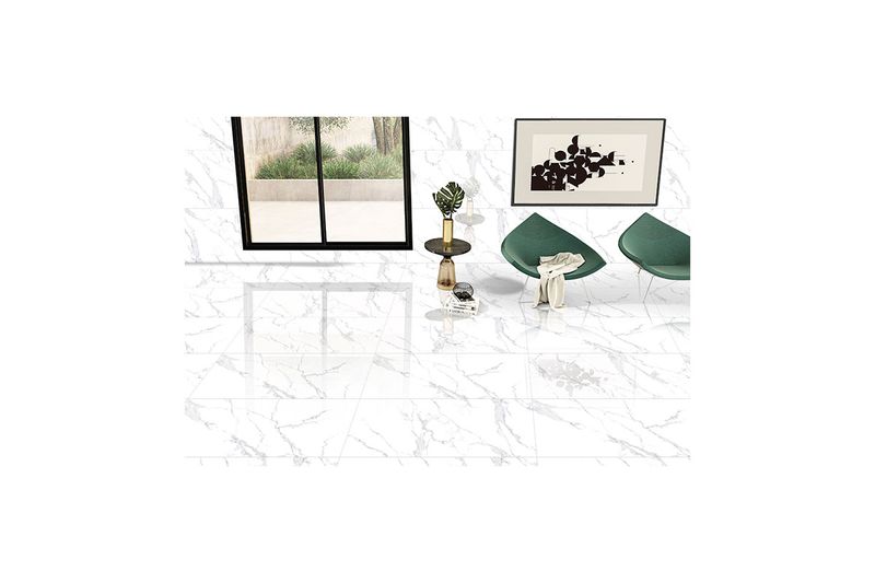Porcelanato 60 x 120 Calacata Statuario mármol brillante recto Overland, ambientado en piso de sala con muebles modernos