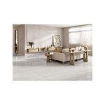 Baldosa 59.3x119 Naica gris mármol satinado rect Porcelanite, instalada en piso de sala con muebles modernos