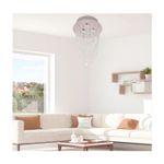 Lámpara colgante cristal Beatice 3L 120V 50W Arteluce, instalada en el techo de una sala con sofá blanco y beige