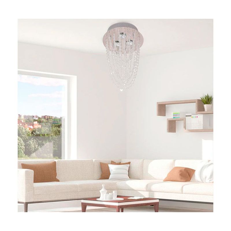 Lámpara colgante cristal Beatice 3L 120V 50W Arteluce, instalada en el techo de una sala con sofá blanco y beige