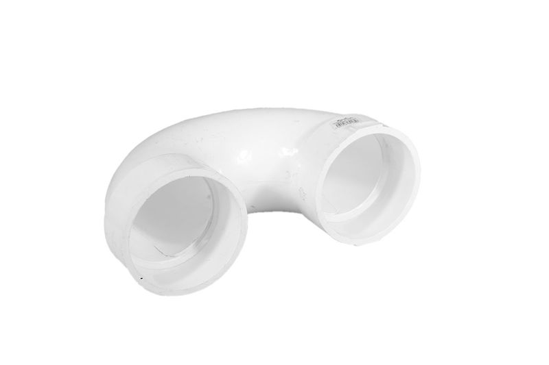 Trampa PVC para baño 4 pulgadas Durman, vista en ángulo desde arriba resaltando la curvatura blanca