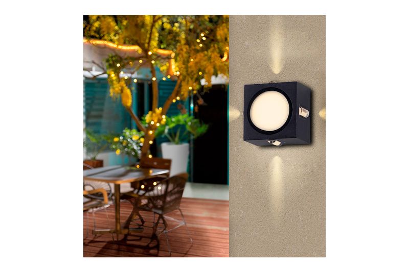 Luminaria de pared al exterior LED Torcular I 10 W 3000 K IP54 negro Tecnolite, encendida instalada en una pared exterior
