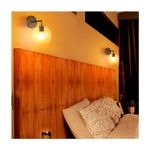 Lámpara de pared interior Cordelia II 1L E27 100-240V IP20 negro Tecnolite, dos unidades instaladas sobre un cabezal de cama